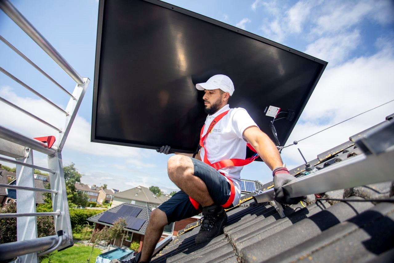 A man in installing solar panels